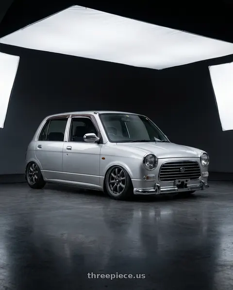 2000 Daihatsu mira gino with Enkei Compe 4x100 15x7+38 Matte Gunmetal wheels