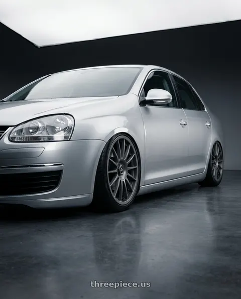 2009 Volkswagen Jetta with fifteen52 PODIUM 5x112 / 5x120 18x8.5 +35 FROSTED GRAPHITE (SATIN GREY) wheels