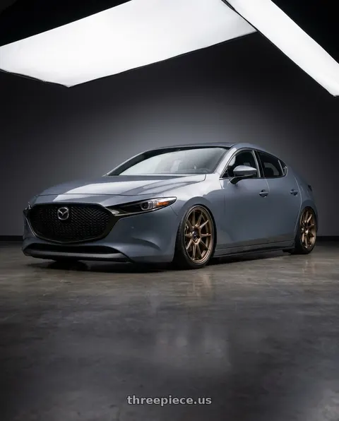 2023 Mazda 3 with Konig Ampliform 5x114.3 18x9.5+25 Gloss Bronze wheels