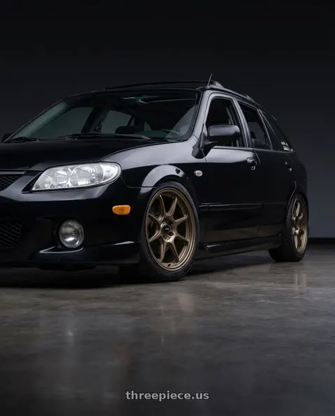 2002 Mazda Protege5 with Konig 102BZ Lockout 5x114.3 16x7.5 +40 Matte Bronze wheels