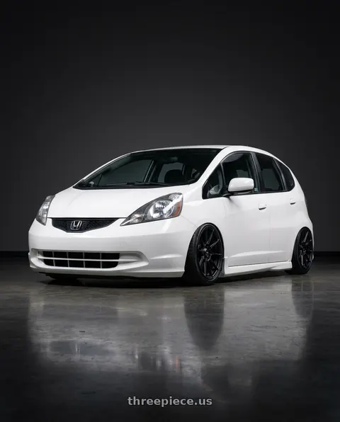 2010 Honda Fit with Advanti Racing 79B Storm S1 4X100 15x8 +25 Matte Black wheels