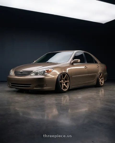 2002 Toyota Camry LE with Kansei K11B Tandem 5x114.3 18x10.5 12 Bronze wheels