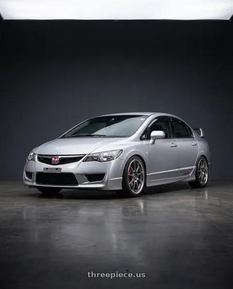 2009 Honda Civic with Enkei J10 4x100/114.3 15x6.5+38 Silver w/ Machined Lip Dia wheels