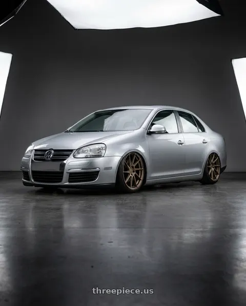 2009 Volkswagen Jetta with Aodhan AH09 5x112 18x9.5 +35 Matte Bronze wheels
