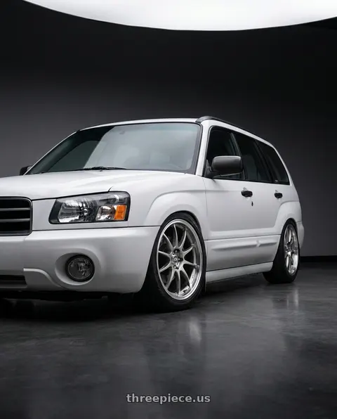 2001 Subaru Forester with Enkei J10 4x100/114.3 15x6.5+38 Silver w/ Machined Lip Dia wheels