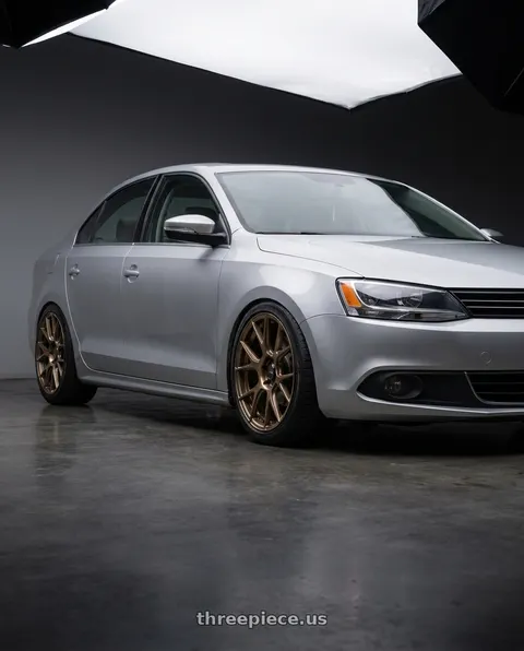 2016 Volkswagen Jetta with Konig Ampliform 5x112 18x8.5+43 Gloss Bronze wheels