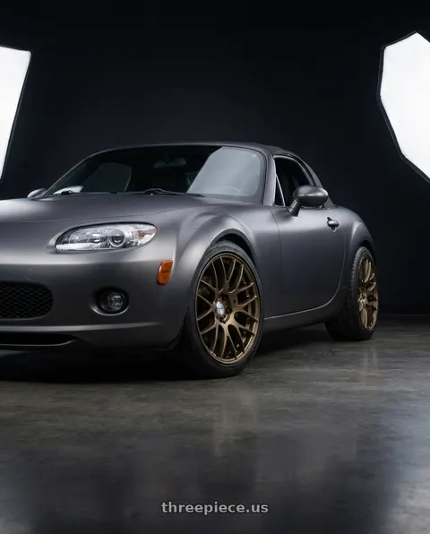 2007 Mazda Miata MX-5 with Work Emotion m8r 5x114.3 17x7 +47 Matte Bronze wheels