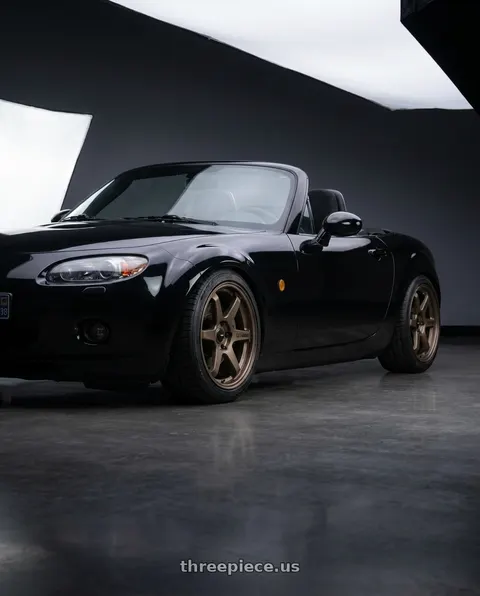 2006 Mazda MX-5 Miata with Enkei T6R 5x114.3 17x8+40 Matte Bronze wheels