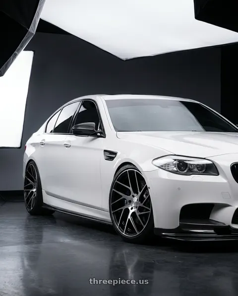 2012 BMW 550i with Status JUGGERNAUT 5X139.7 20X9 +20 GLOSS BLACK W/ MACHINED FACE wheels
