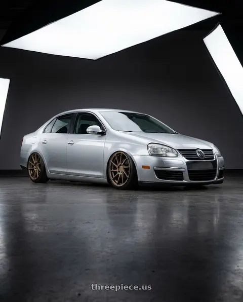 2009 Volkswagen Jetta with Aodhan AH09 5x112 18x9.5 +35 Matte Bronze wheels