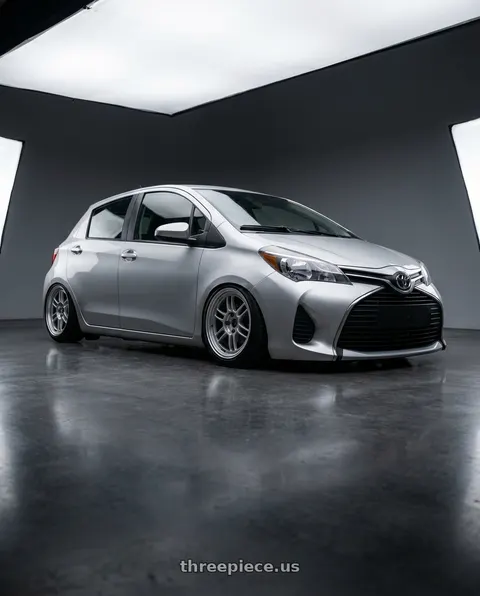 2015 Toyota Yaris with Enkei RPF1 4x100 16x7+43 Silver wheels