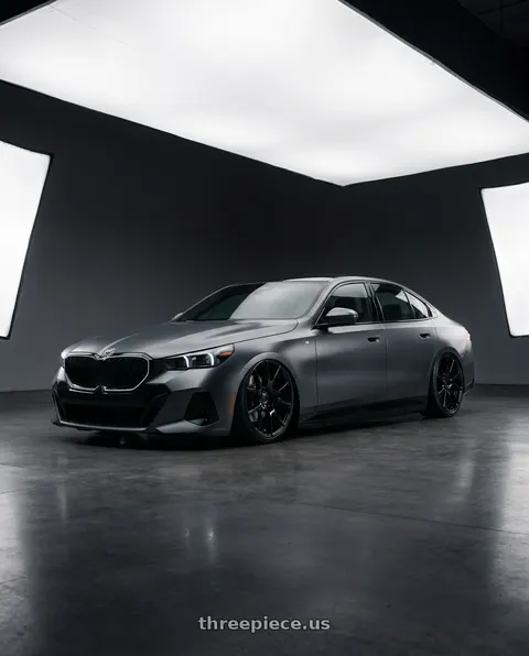 2024 BMW i5 with OEP 161B 5X115 22x9 +15 Gloss Black wheels