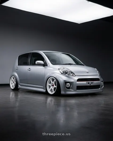 2010 Toyota passo racy with Enkei PF06 4x100 15x8+25 White Machined wheels