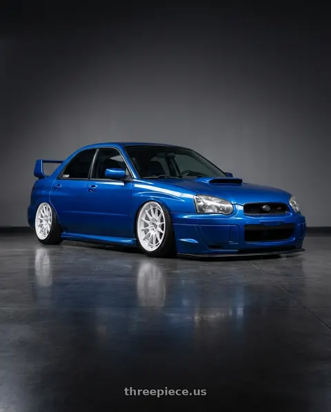 2004 Subaru Impreza WRX STI with Enkei NT03+M 5x114.3 18x9.5+40 Vanquish White wheels