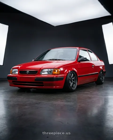 1996 Toyota Tercel with Enkei Compe 4x100 15x8+25 Gunmetal wheels