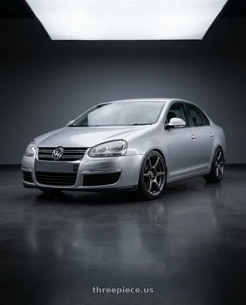 2009 Volkswagen Jetta with Kansei K11G Tandem 5X112 18x8.5 35 Gunmetal wheels