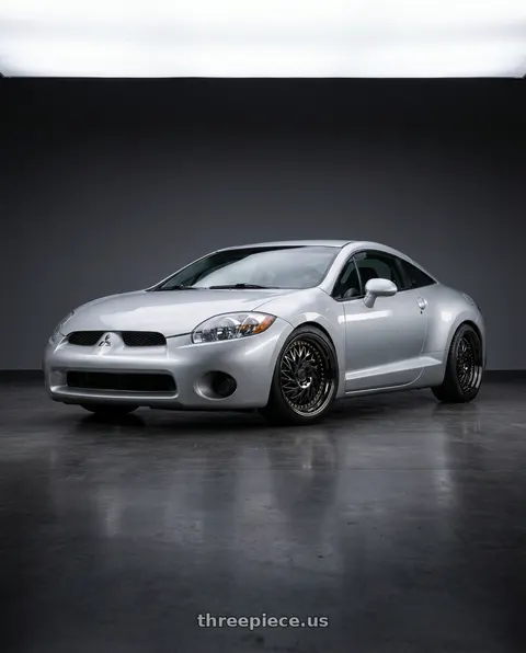 2010 Mitsubishi Eclipse with Aodhan DS03 5x114.3 18x9.5 +30 Black Vacuum w/ Gold Rivets wheels