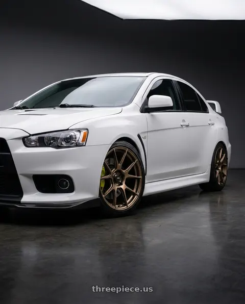 2010 Mitsubishi Lancer with Konig Ampliform 5x114.3 18x9.5+35 Gloss Bronze wheels