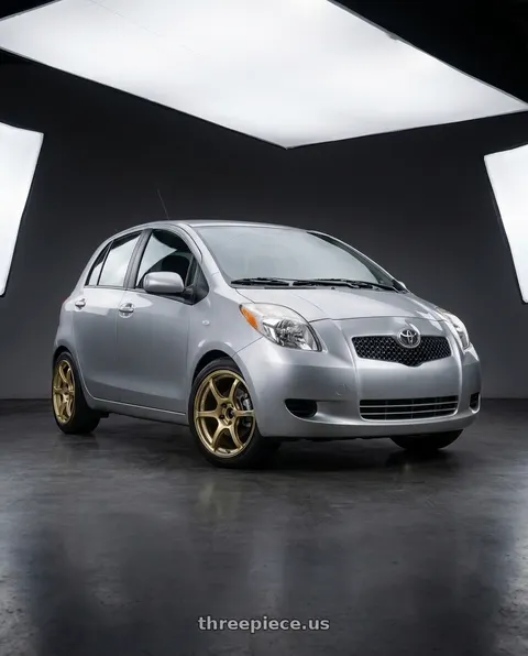 2006 Toyota Yaris with Advan RGIII 4x100 18x7.0+42 Gold wheels