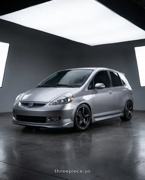 2007 Honda Fit with Advan Racing TC4 4x100 15x7.0 +42 BLACK GUNMETALLIC & RING wheels