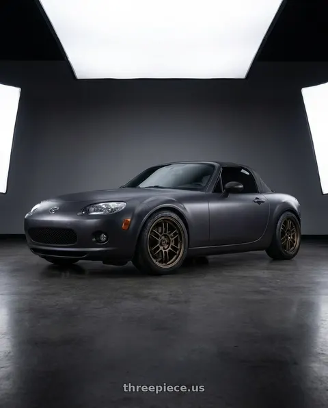 2007 Mazda Miata MX-5 with Volk Racing RAYS F6 BOOST 5x114.3 17x7+40 Dark Bronze wheels