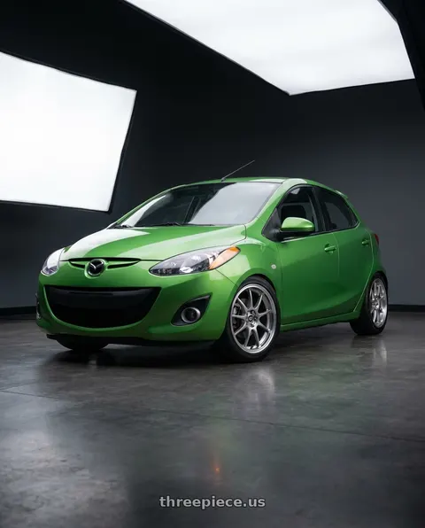 2011 Mazda 2 Sport with Enkei J10 4x100/114.3 15x6.5+38 Silver w/ Machined Lip Dia wheels