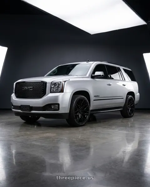 2020 GMC Yukon Denali with O.E. Revolution 158 6x139.7 22x9 +24 Gloss Black wheels