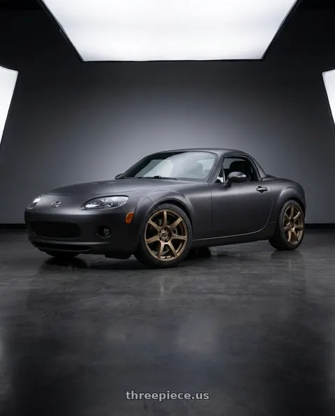 2007 Mazda Miata MX-5 with Work Emotion T7r 5x114.3 18x7.5 +47 Matte Bronze wheels
