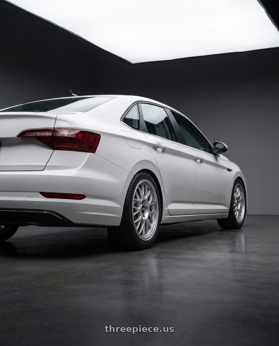 2019 Volkswagen Jetta Sel with BBS RG-F 5x100 16x7.0+35 Brilliant Silver wheels rear three quarter view square tires