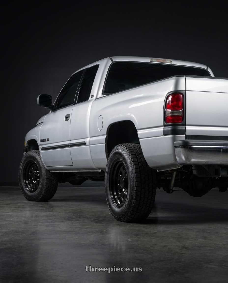 1998 Dodge ram 2500 V with Vision HD 84H 8x165.1 17x9-12 Gloss Black wheels rear three quarter view square tires