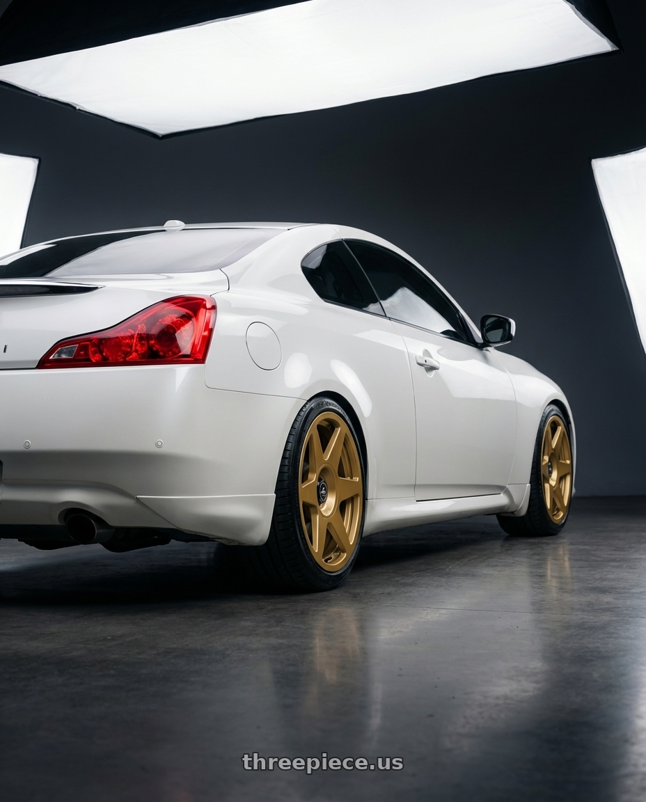 2014 Infiniti G37 Coupe with fifteen52 TARMAC EVO 5x114.3 / 5x120 19x8.5 +35 GOLD (GLOSS GOLD) wheels rear three quarter view square tires