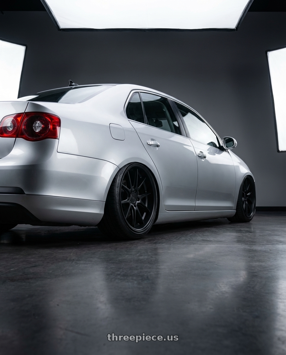 2009 Volkswagen Jetta GLI MK5 with Niche 1PC M117 MISANO 5X112 18X9.5 +35 MATTE BLACK wheels rear three quarter view slight stretch tires