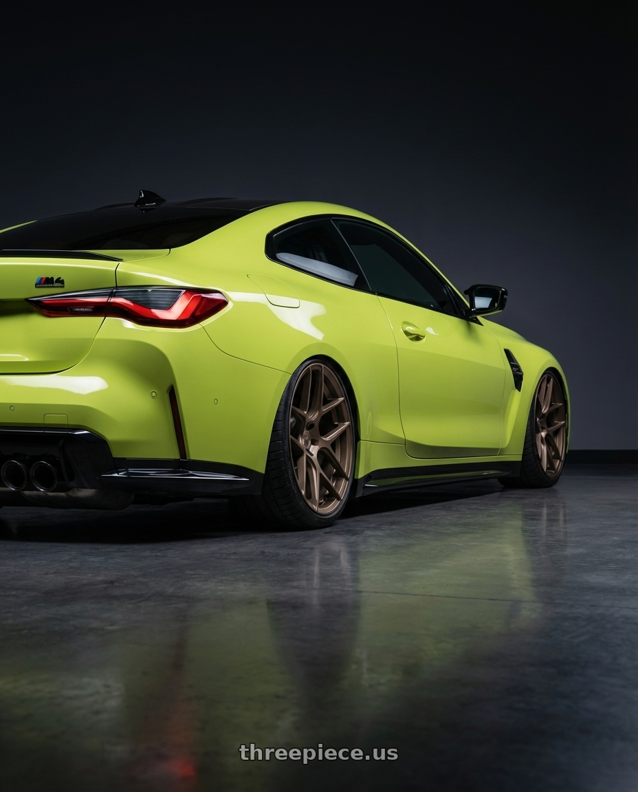 2024 BMW M4 G82 with Aodhan AFF2 5x112 19x9.5+35 Matte Bronze wheels rear three quarter view slight stretch tires