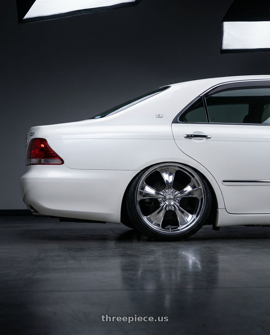 2005 toyota crown with Strada Street Classics Old Skool 5x127 24x10 +15 Chrome wheels rear three quarter view slight stretch tires