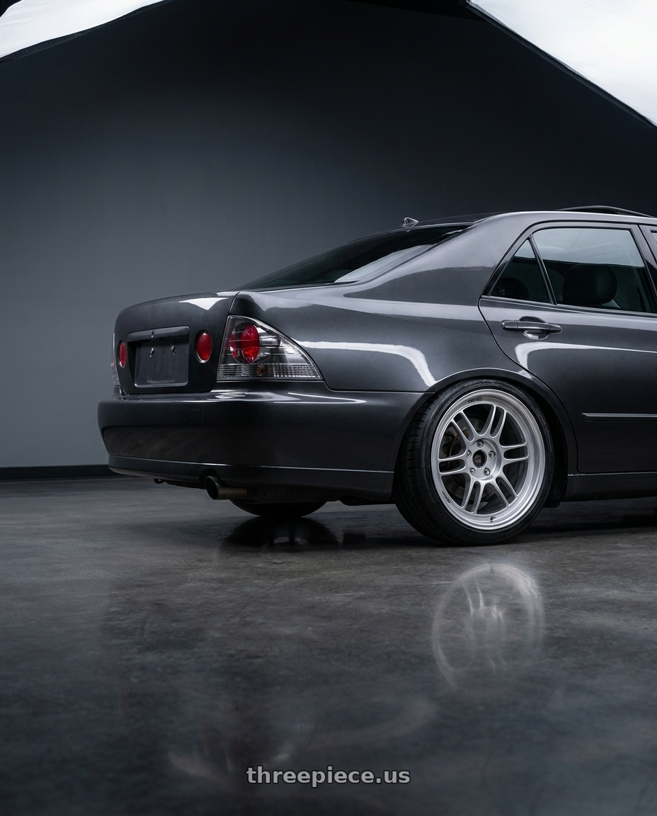 2003 lexus is300 with Enkei RPF1 4x100 15x7+41 Silver wheels rear three quarter view square tires
