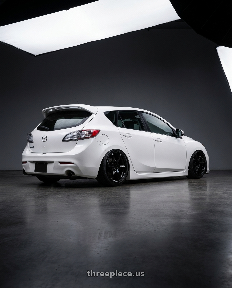 2012 Mazda Mazdaspeed3 with Advan RGIII 5x114.3 18x10+35 Gloss Black wheels rear three quarter view slight stretch tires