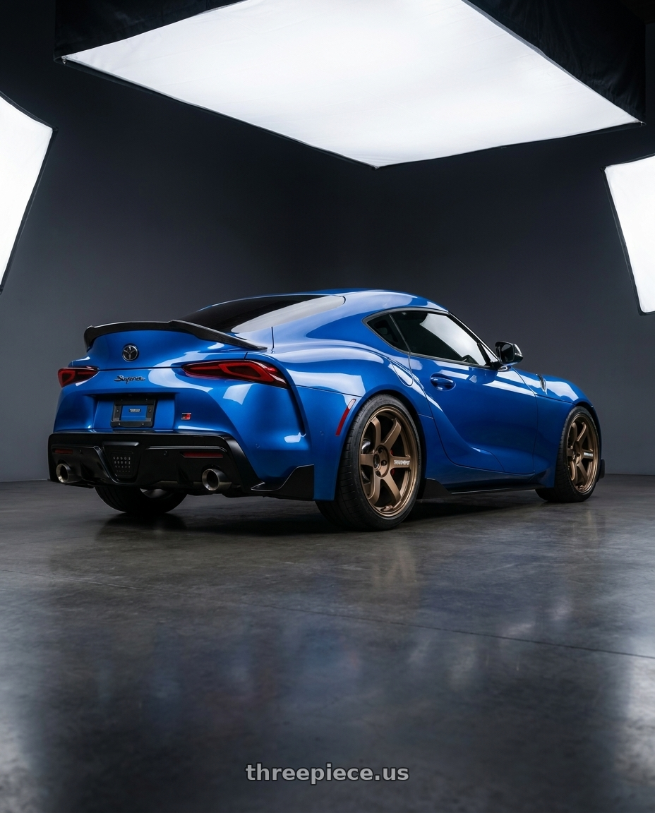 2023 Toyota supra with Volk Racing TE37 SAGA S-PLUS 5x112 18x10.5 +30 BRONZE wheels rear three quarter view square tires