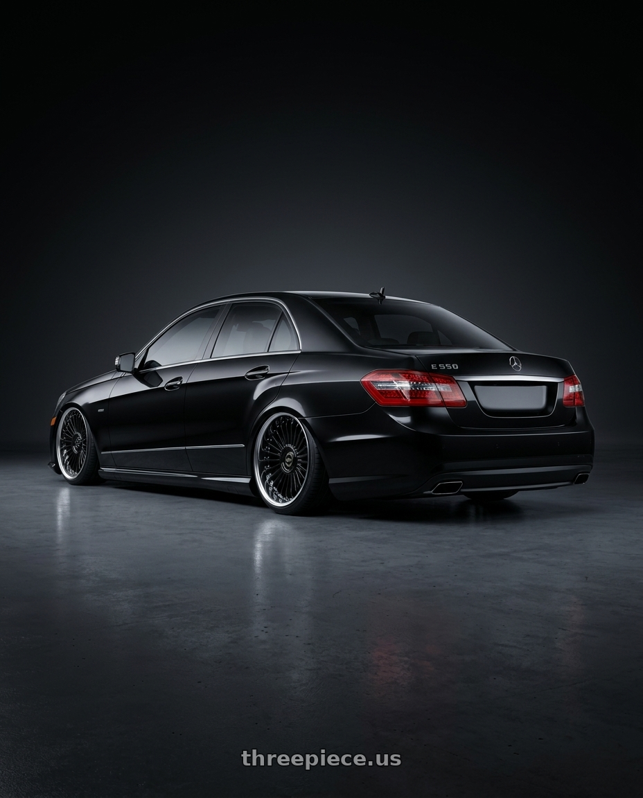 2010 Benz E550 with Work Emitz Black Polish 5x100 19x9.0 +12 wheels rear three quarter view slight stretch tires