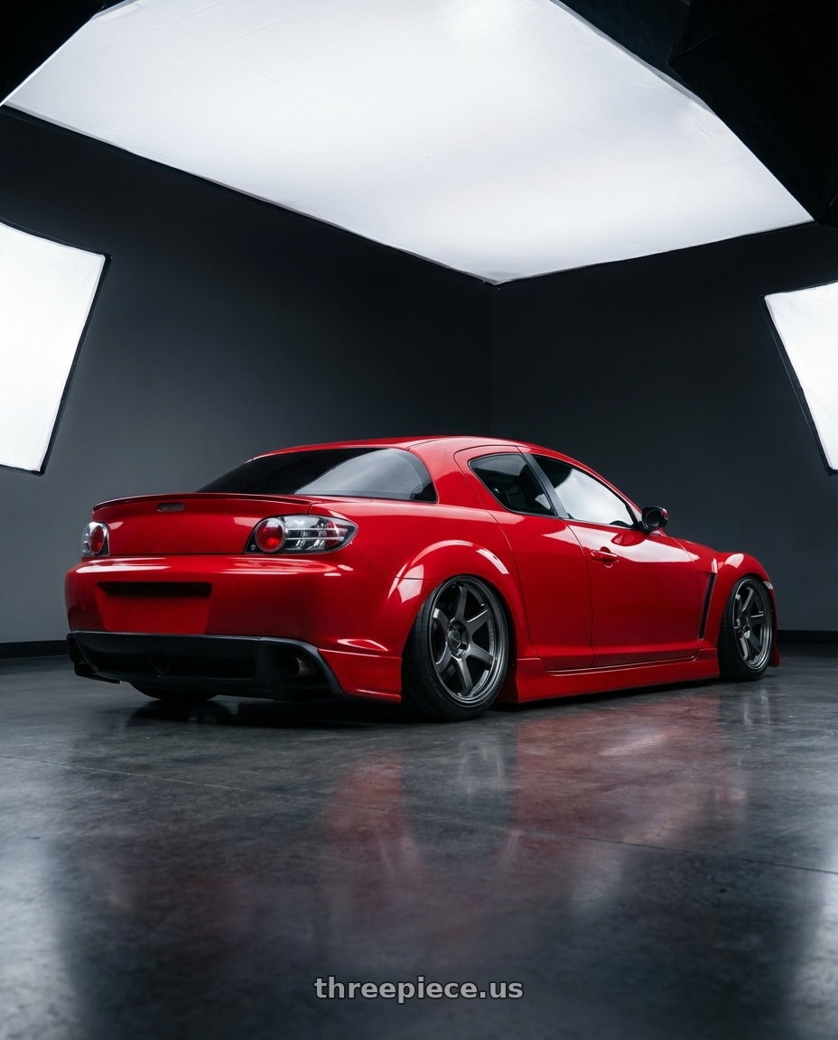 2004 Mazda rx8 with Kansei K11G Tandem 5x114.3 17x9 22 Gunmetal wheels rear three quarter view slight stretch tires