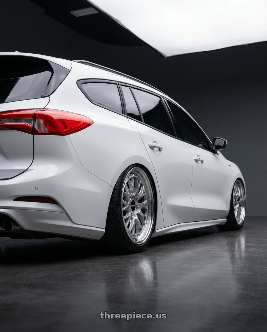2025 ford focuswagon with Rotiform 1PC R155 LSR 5X112 19X8.5 +35 GLOSS SILVER MACHINED wheels rear three quarter view slight stretch tires