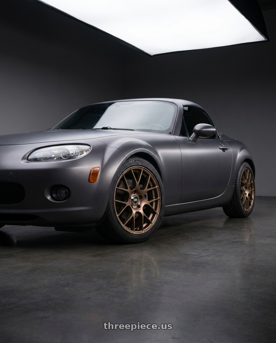 2007 Mazda Miata MX-5 with Enkei Raijin 5x114.3 18x8+40 Bronze wheels