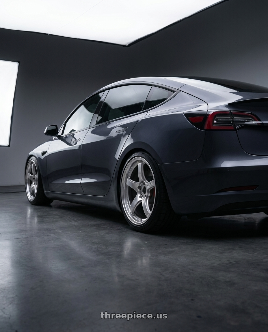2023 Tesla Model 3 Performance with Gram Lights 57CR 5x114.3 19x9.5 +25 GRACE SILVER wheels rear three quarter view slight stretch tires
