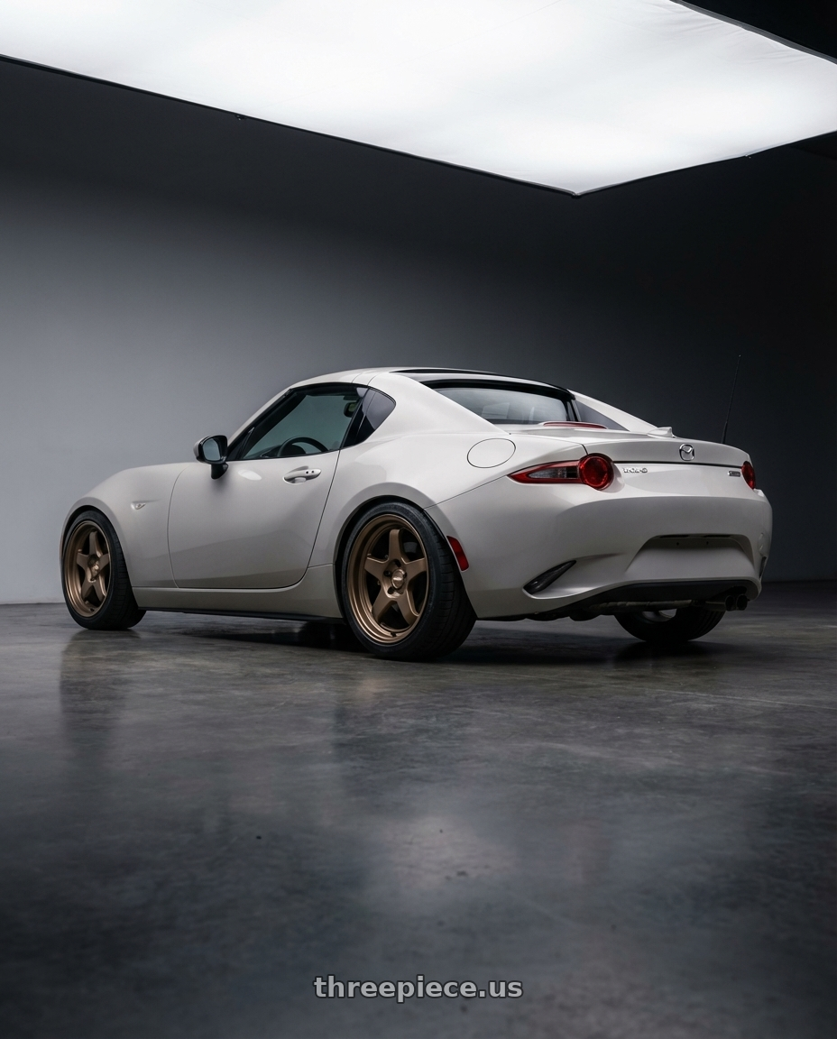 2021 Mazda MX-5 Miata ND with Kansei K12B KNP 5x114.3 17x9 35 Bronze wheels rear three quarter view square tires