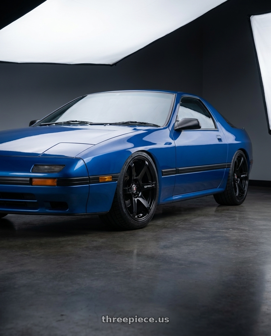 1991 Mazda RX-7 with Spec-1 SPT-32 5x114.3/5x120 17x8 +42 Gloss Black wheels front three quarter view lowered stance