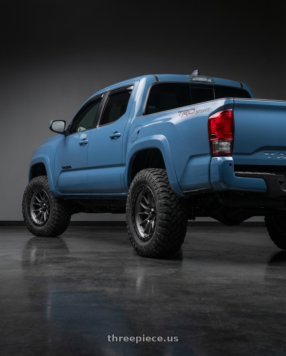 2019 Toyota Tacoma TRD Sport with LOCK OFFROAD KRAWLER 6x135 17x9 -12 Matte Grey W Matte Black Ring wheels rear three quarter view meaty tires