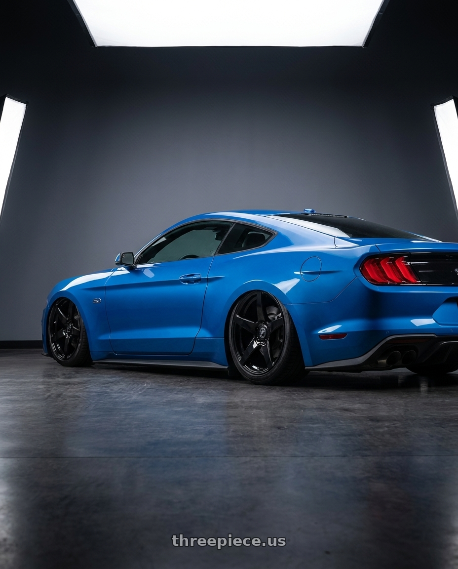 2022 Ford Mustang GT with Forgestar CF5 5x114.3 20x9.5 +29 Gloss Black wheels rear three quarter view slight stretch tires