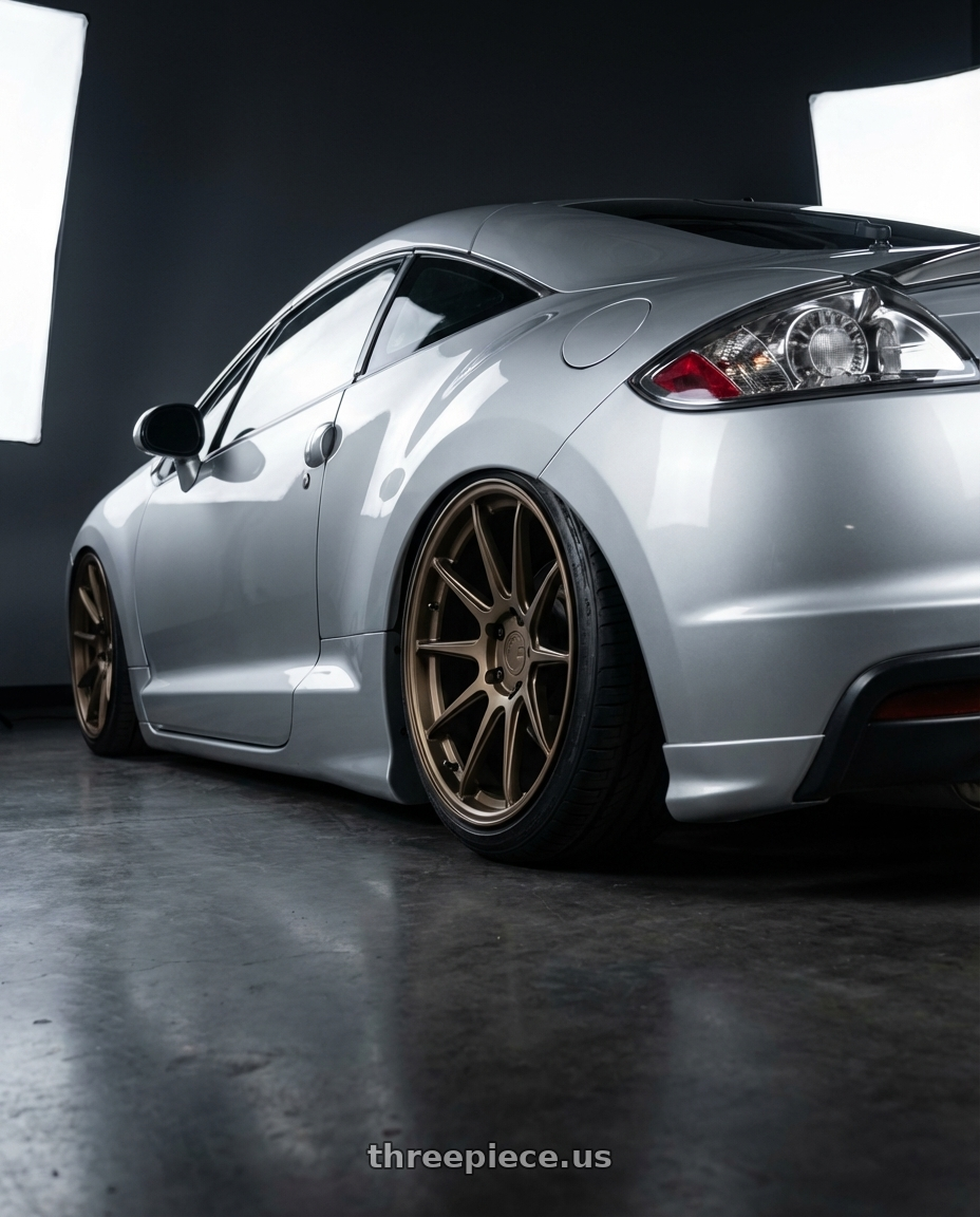 2010 Mitsubishi Eclipse with Aodhan AFF2 5x114.3 19x9.5+35 Matte Bronze wheels rear three quarter view slight stretch tires