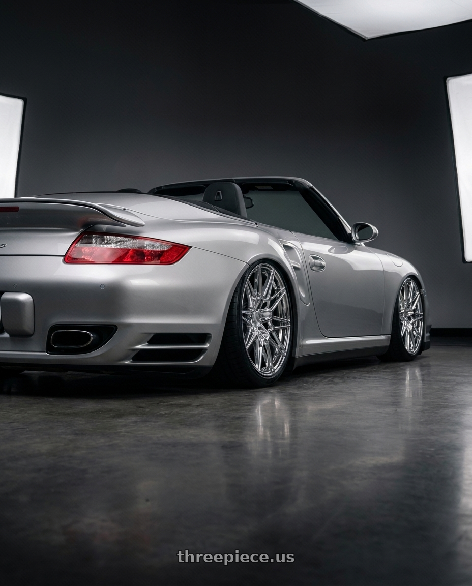 2008 Porsche 911 Turbo with Axe CF1 5x130 20X9+45 CHROME wheels rear three quarter view slight stretch tires