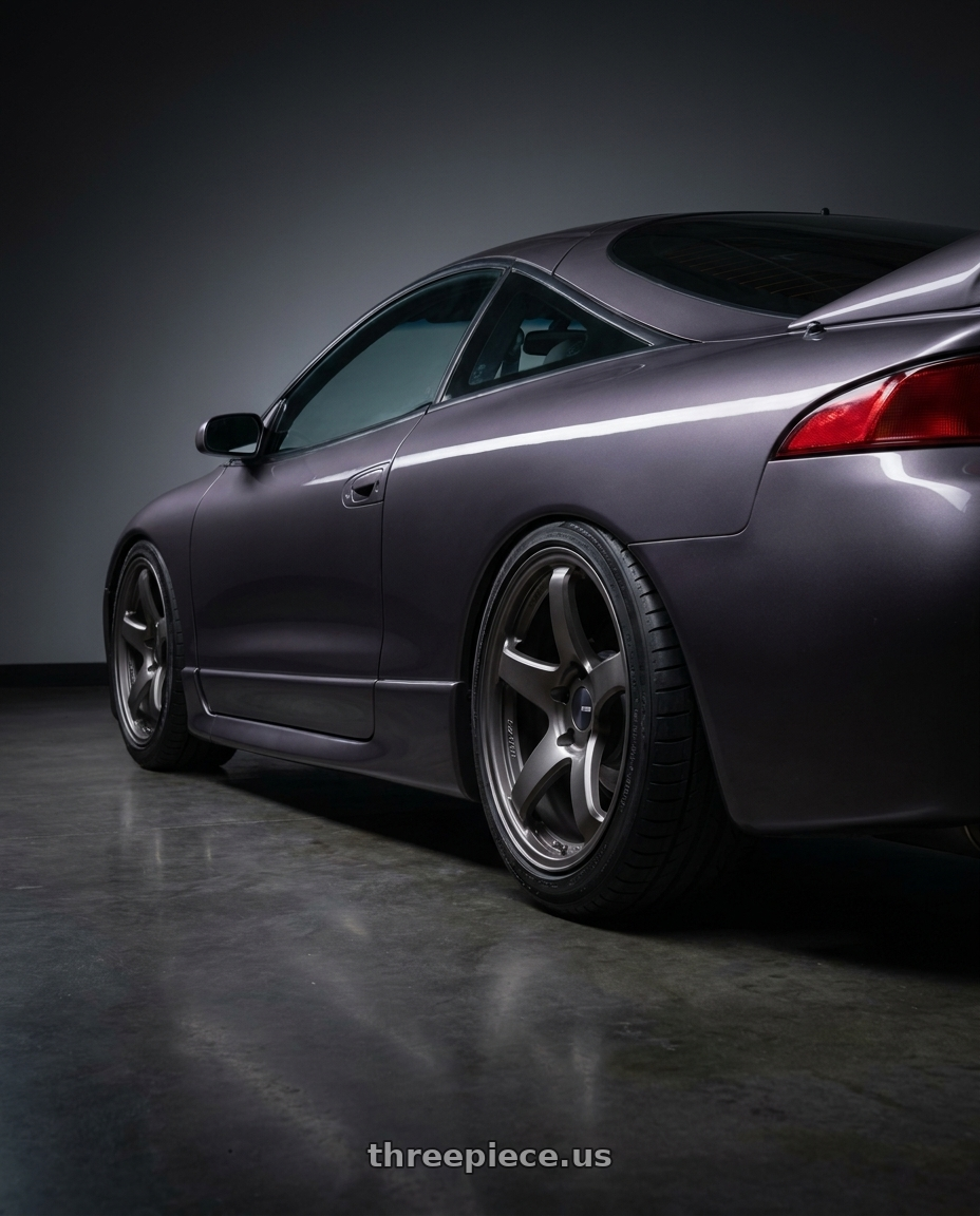 1997 Mitsubishi eclipse with Enkei PF05 5x114.3 18x9.5+38 Matte Gunmetal wheels rear three quarter view square tires