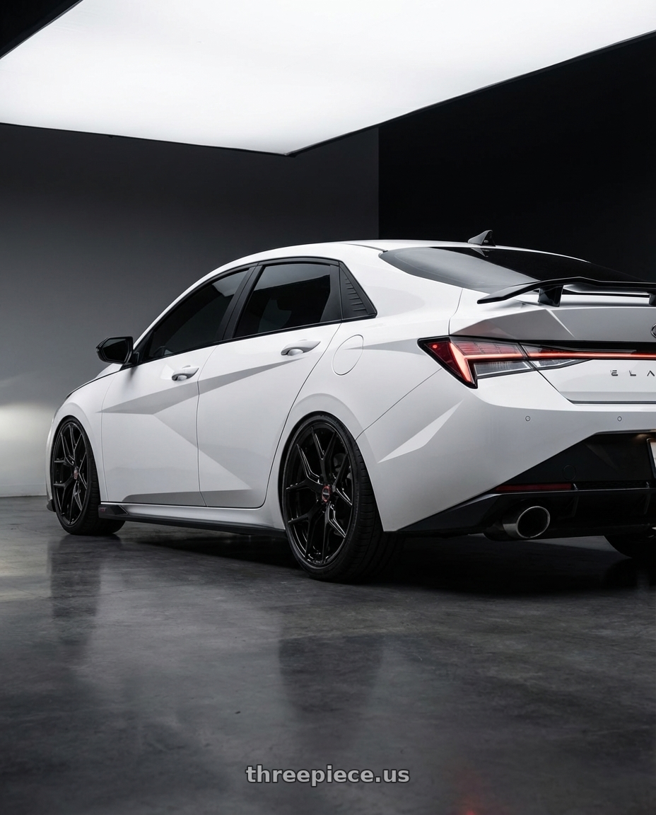 2024 Hyundai Elantra N with Vossen HF-5 19x9.5 / 5x114.3 / ET40 / Deep Face / 73.1 - Gloss Black Wheel - HF5-9N63 wheels rear three quarter view slight stretch tires